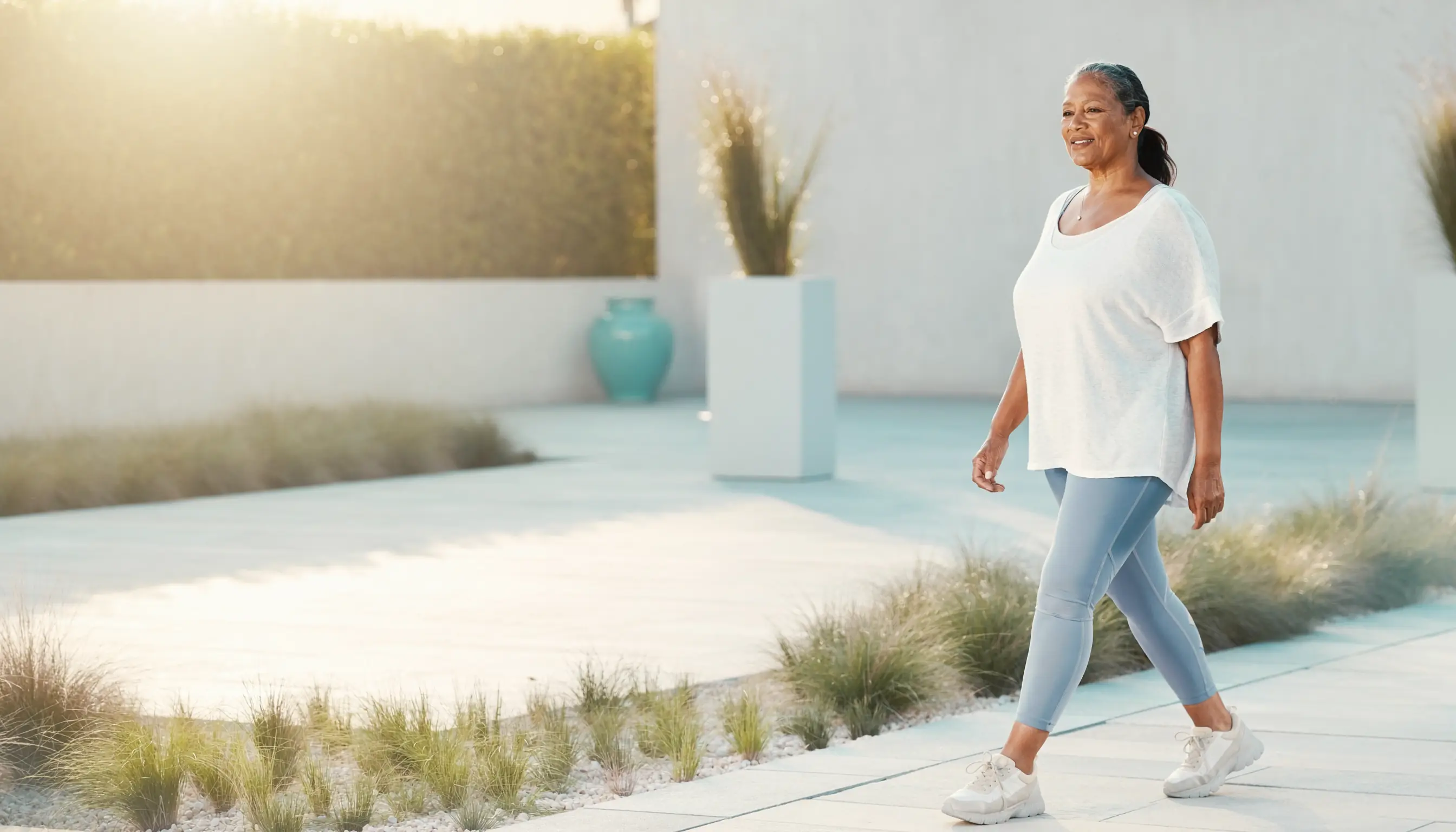 Woman enjoying a comfortable morning walk in a bright garden